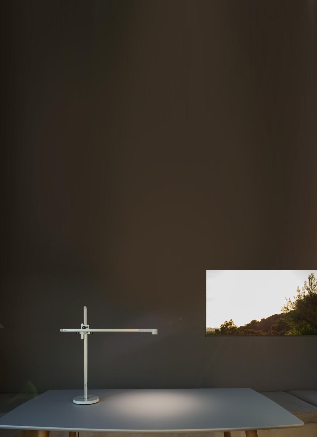 The Dyson Lightcycle™ task light adjusting with daylight outside a window